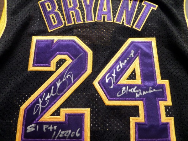 This black XXL Los Angeles Lakers jersey from Adidas is still tagged as new, and comes trimmed in yellow and purple, with everything professionally-sewn.  It is hand-signed on the back number in silver by Kobe Bryant himself, the FULL NAME signature grading an overall 8, with 81 Pts 1/22/06, Black Mamba, and 5X Champ inscriptions.  With Kobe's death now 4 years ago, retail is well into the thousands!