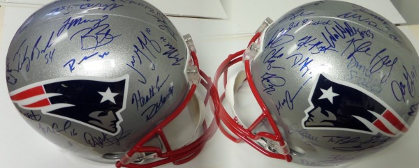 This full size replica style silver helmet from Riddell features Patriots logo on either side, and comes hand signed in blue sharpie by more than 35 members of the 2nd team in NFL history to make it through a regular season undefeated!  Included are Bill Belichick, Tom Brady, Randy Moss (slight smudge), Junior Seau (dec), Bruschi, Rodney Harrison and so many others on this helmet that can retail in the low thousands!