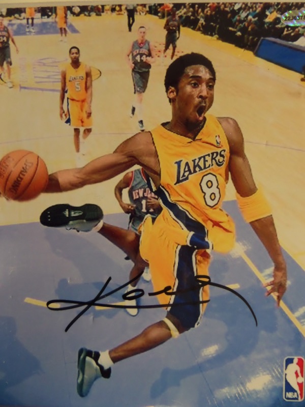 This stunner is a color 8x10, shows the HOF'er in action, and comes boldly, perfectly black sharpie signed on a perfect spot. It is a clean bold 10 all over, shows off EZ from 30 feet away, and comes fully lifetime certified as genuine. Great buy and hold NBA investment, and sold here with NO reserve! 