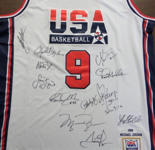 This white size L Mitchell & Ness #9 USA Basketball Michael Jordan jersey is NEW with original tagging attached, has everything sewn, and comes front signed in black sharpie by by all 12 members of the original Dream Team!  Included are Bird, Magic, Jordan, Barkley, Ewing, Drexler, Robinson, Malone, Stockton, Pippen, Laettner and Mullin, and this AWESOME and one of a kind display item books well into the low thousands!