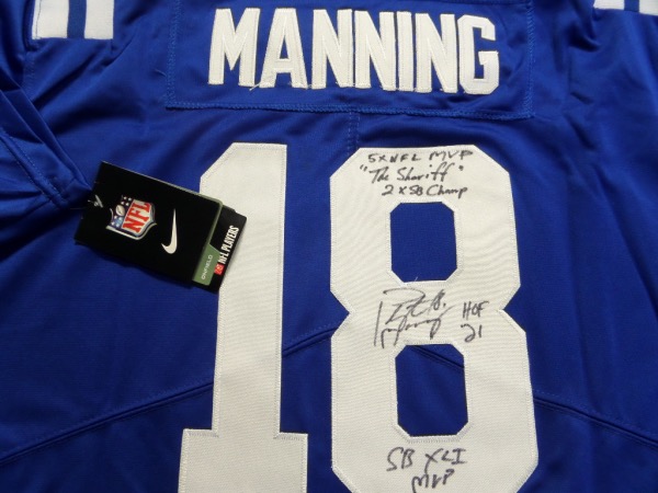 This blue size L Indianapolis Colts #18 Manning jersey from Nike is still tagged as NEW, and comes with everything professionally-sewn.  It is back number-signed in black  sharpie by the record-smashing passer himself, grading an overall 8, and including 18, "The Shefiff", 2X SB MVP, 5X NFL MVP, SB XLI MVP, and HOF '21 inscriptions.  A MUST for the Manning superfan, and retail is high hundreds!