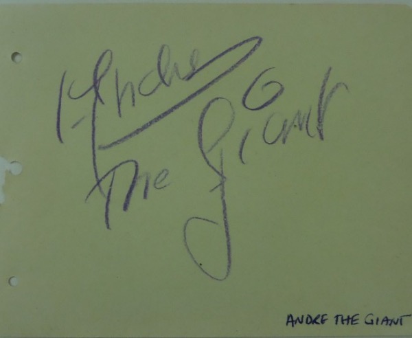 This 4.25x5.5 piece of paper has rounded edges on the right hand side, and a triple hole punch on the left, suggesting that it was obtained from a collector's album.  This particular page features the purple artist's pencil signature of the incomparable Andre the Giant, one of the most famed wrestlers of all time, and grades about a 7 overall.  Perfect for matting and framing, and with Andre's death now three decades ago, retail is well into the hundreds!