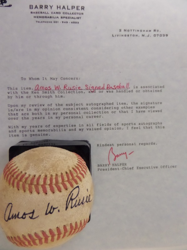 This vintage, red-laced baseball is in G+ condition, and comes hand-signed in black fountain pen ink across the sweet spot by "The Hoosier Thunderbolt," himself, Hall Of Fame New York Giants flamethrower, Amos Rusie.  The signature is a nice example, reading Amos W. Rusie, with a grade of 7 in order, and the ball comes with a full LOA from Barry Halper for authenticity purposes.  Valued well into the thousands!