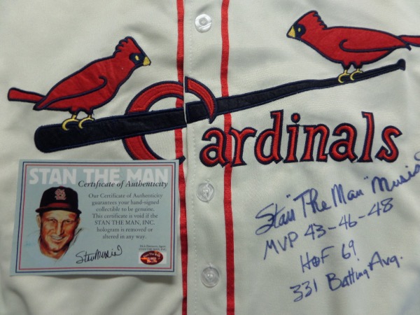 This double certified and hologrammed item comes right from his "Stan the Man" company and is a real Mitchell & Ness 1944 styles home white Cardinals jersey. This thing is a 10 all over, comes blue sharpie signed by Stan with added career stats, and value is about a grand on this top tier Cooperstown prize.