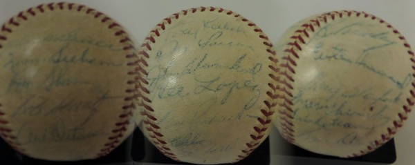 This relic is an official AL ball, comes blue ink signed by most of the team, and does offer a clubhouse Mantle signature. All tghe test look good however, and names like Berra, Lopez, Kubek, Shantz, Terry and many more appear. Overall, and honest 3.5-4 is in order for a grade, and most names can at least be made out. 