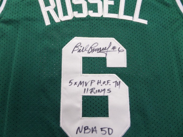 This MUST HAVE NBA item is a green 1962-63 size 44 custom Boston Celtics #6 Russell throwback jersey, still tagged as NEW from Mitchell & Ness, and trimmed in white, with everything sewn.  It is back number-signed in black sharpie by the greatest center EVER, grading a legible 8, with #6, 5X MVP, HOF 74, NBA 50 and 11 Rings inscriptions, and with Russell no longer with us, retail is low thousands on this collector's gem!