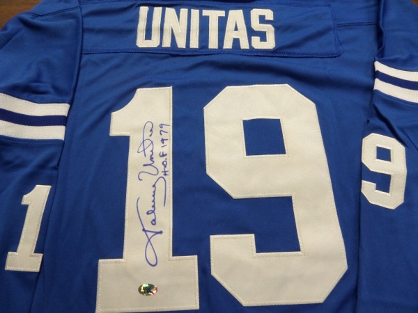 This blue size 52 Baltimore Colts custom 1970 throwback jersey from Mitchell & Ness is in NM/MT condition, and comes trimmed in white, with everything hand-stitched.  It is back number-signed in blue sharpie by the all time great passer himself, grading a legible 9, and including a HOF 1979 inscription.  With his death now two decades ago, retail on this gorgeous jersey is low thousands!