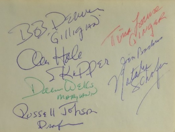 This full autograph album page has rounded edges on the right, is in EX/MT shape, and measures 4x5.5 in size.  It is hand-signed in blue, red and green by 7 cast members from the hit 1960's comedy series, including Denver, Hale, Schaeffer, Wells, Louise, Johnson and Backus, and comes with a color photo for matting and framing, and with 5 of the 7 no longer with us, retail is low thousands on this RARE item!