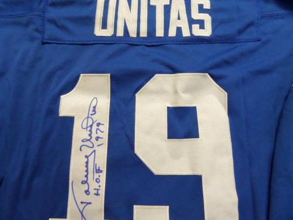 This blue size 52 Baltimore Colts custom 1970 throwback jersey from Mitchell & Ness is in NM/MT condition, and comes trimmed in white, with everything hand-stitched.  It is back number-signed in blue sharpie by the all time great passer himself, grading a legible 8, and including a HOF 1979 inscription.  With his death now two decades ago, retail on this gorgeous jersey is low thousands!