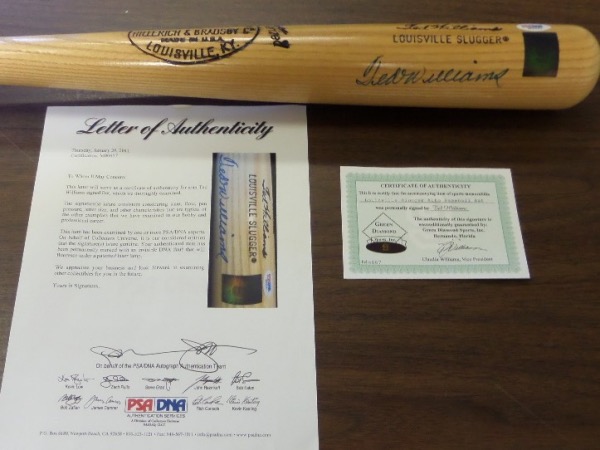 This amazing offering is a MINT Ted Williams genuine signature model blonde H&B Louisville Slugger baseball bat that comes blue sharpie signed by the man himself, 2 time Triple Crown winner, Ted Williams.  The signature grades a solid, legible 8, and the bat includes both a "Green Diamond" hologram/COA and a full photo LOA from PSA/DNA (M00657) for authenticity purposes.  A true thing of beauty, valued at $2000.00!