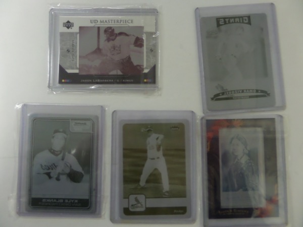 This rare lot is THE actual printing plate from the card, and each is a scarce one of a kind. The cards are: Jason LaBarbera NHL Kings with the UD COA & hologram, Omar Vizquel Giants w/Topps hologram, Braden Cooper Cardinals w/Fleer hologram, Kyle Blanks Padres with Bowman Chrome hologram and Florence Nightinggale from Allen & Ginters with their hologram as well. 