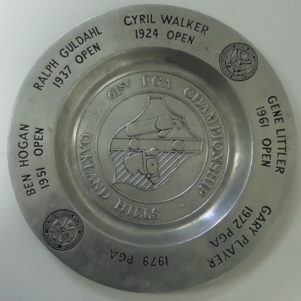 This 12" diameter commemorative pewter plate is in EX overall condition, and was give to competitors of the 61st PGA Championship.  It is engraved around the circumference listing 5 champions, including Player, Littler, Walker, Guldahl and HOgan, and has room for the 1979 Champion (Graham) to have been added.  A stunning PGA collectible, valued at PRICELESS!