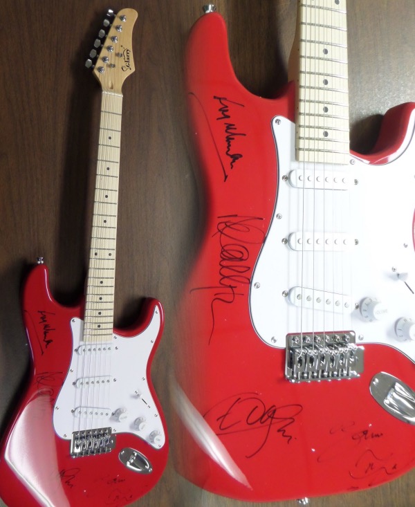 This STUNNING mint bright red electric beauty comes in box with original carry bag, straps,etc.  It comes signed perfectly in black by ALL 4 guys with a great personal portrait of his face by Bono.  Also included are Adam Clayton, Larry Mullen Jr. & the Edge.  Guaranteed authentic and retails into the thousands easily.