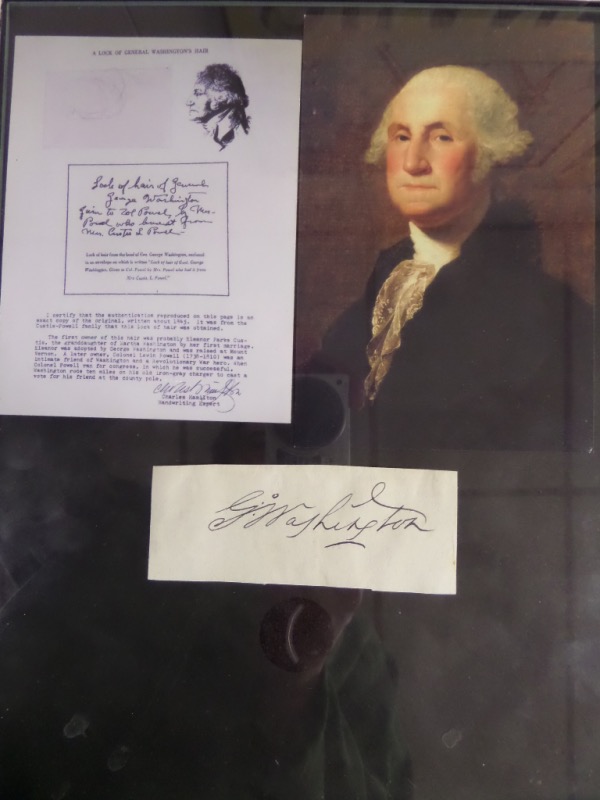 This remarkable find is a framed display, about 9x12 in size, and holds a real piece of our nations 1st ever President's hair. It is just a lock, comes matted with a signature in vintage ink and color 1700's photo of George, and value is ?