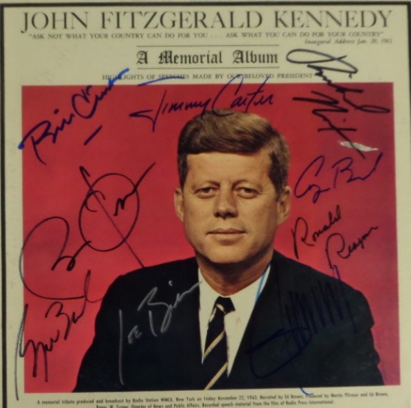 This original "John Fitzgerald Kennedy: A Memorial Album" is from the 1960's, and is still in EX shape overall, with a color image of JFK on the front cover.  It is hand-signed in blue, silver and black felt tip marker by 7 men who have followed JFK as Commander In Chief, including Reagan, Nixon, Carter, Bush, Clinton, Bush, Obama, Trump and Biden.  Awesome Presidential collector's item, and with 1/3 deceased, retail is well into the thousands!