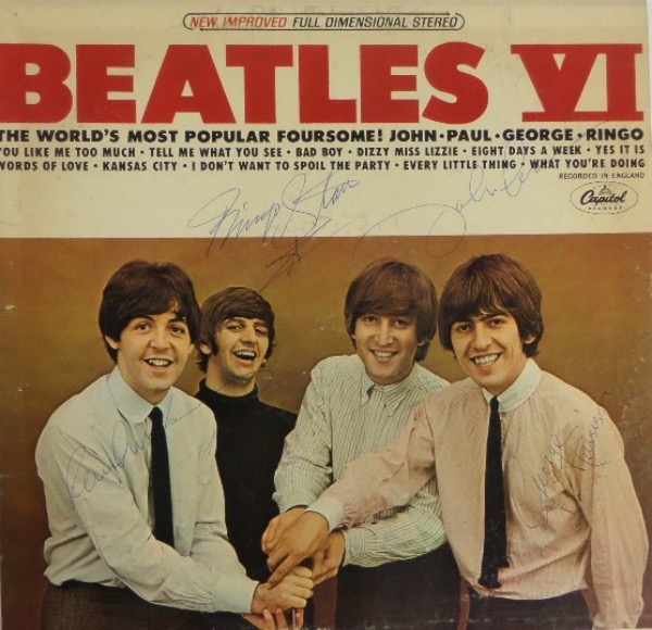 This original 1965 "Beatles VI" LP album is an American Capitol Records only release, and comes hand-signed in blue ink by all four members of the greatest band of all time!  These are sharp signatures, considering they are probably all 50 years old, and each grades a 6-8 overall.  With half of the band now deceased, retail here is well into the thousands!