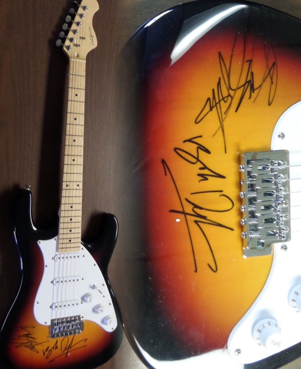 This amazing rock n' roll HOF worthy display item is a mint, new and full-sized electric guitar, done in a few gorgeous colors, and comes hand signed by BOTH the Boss and Dylan on perfect spots. This gem grades a 10 all over, value is thousands on the pair of legendary rockers, and it is an easy buy and hold musical investment chance. 