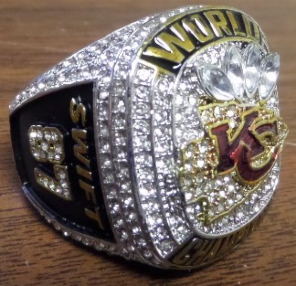 This Custom Ring is Exactly like the 20223/2024 Kansas City Chiefs Super Bowl Winning rings and has their famous Fan "Taylor Swift's" Name along with Kelce's #87.  This Ring is RARE with her name on it and it has the SB winning score, the Lombardi Trophy LVIII and 2023 engraved beautifully on one side, with "SWIFT 87" on the other side and the 87 is in CZ Diamonds. Your wife, Girlfriend or daughter will love this Gorgeous ring!!