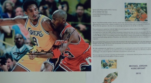 This full color 8x10 photo shows Kobe backing down Jordan during a 1998 Lakers/Bulls NBA contest.  It is hand-signed in black sharpie by both all time greats and includes a full photo LOA from Sports Cards Memorabilia & More.  Valued into the high hundreds!