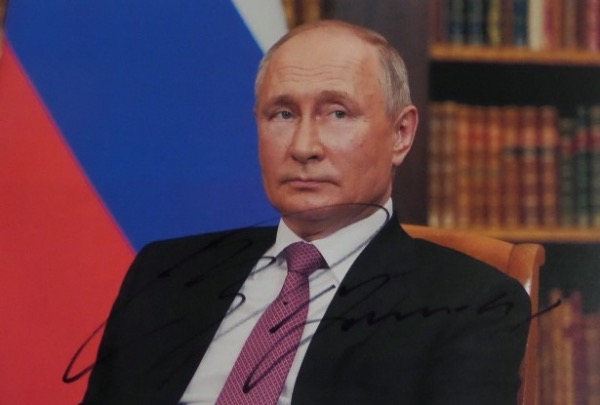 Regardless of what you think of the guy, anything signed by him is absolutely RARE in this country!  This full color 8.5x11 photo is hand-signed in black sharpie by the Russian President himself, the signature grading a legible 7.5-8, and retail on this great-looking photo is mid/high hundreds!