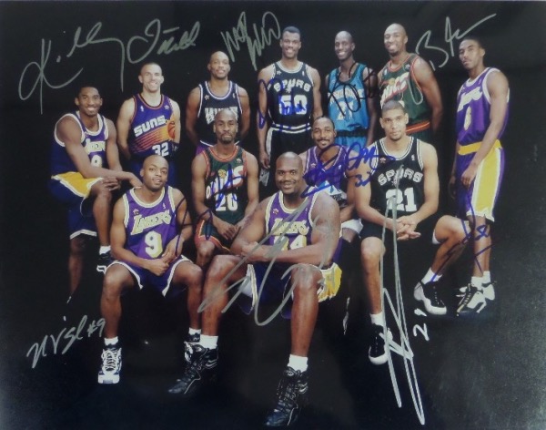 This gorgeous color 11x14 photo shows all 12 members of the '98 West All Star Team, each in his own team's uniform, making for a nice color collage of uni's against a black background.  It comes hand signed by all 12 guys in black, blue and silver, and included are Kobe, Garnett, Kidd, Robinson, Duncan, Shaq, Payton, Malone, Van Exel, E. Jones, Baker, and Richmond.  What an awesome display item, and one valued into the mid hundreds!