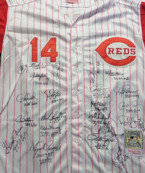 This home white size L throwback Reds #14 Pete Rose jersey is still in NM overall condition.  It is hand-signed in black sharpie by 21 members of the 3000 Hit Club, including Mays, Murray, Rose, Carew, Brett, Winfield, Yount, Aaron, Yaz, Murray, Jeter, Molitor, Boggs, ARod, Biggio, Palmiero, Pujols, Ripken, Henderson, Beltre and Ichiro.  Awesome looking jersey, ready for framing, and valued well into the low thousands!