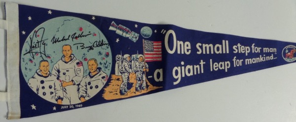 This 27" long "One Small Step ..." blue pennant is still in EX+ condition overall, with an Apollo 11 logo, artist's images of the astronauts, and Armstrong quote.  It is hand-signed in black sharpie by all three, including Neil Armstong, Buzz Aldrin and Michael Collins, and retail on this gem is easily into the low thousands!