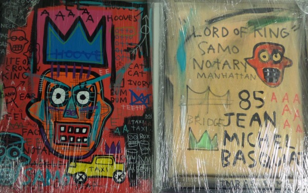 This approximately 16"X24" piece is an original JM Basquiat artwork done on canvas and framed wonderfully.  It is an image of a face with writing all around, and comes titled on the reverse by the artist himself from 1985.  It is a perfect size for display and display, and, with his death now 35 years ago, retail is low thousands and tons of inscriptions from him on the back! WOW!