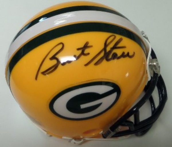 This Green Bay Packers mini football helmet from Riddell is in NM condition, and comes hand-signed in bold black sharpie by 2 time Super Bowl MVP and HOF passer, Bart Starr.  The signature grades an overall, legible 8, and with Starr no longer with us, retail is mid/high hundreds!