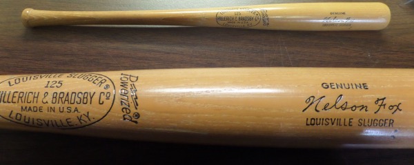 This 31.5" long wooden Louisville Slugger 125 bat from Hillerich & Bradsby is a pro model/game issue bat that comes to us in EX+ to NM overall condition.  It is a Nelson Fox signature model and shows decent use but zero chipping or cracking, and will make for an outstanding addition to your vintage baseball collection!