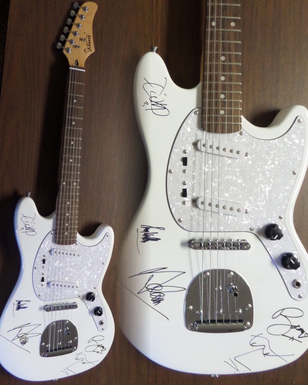 This STUNNING mint white electric beauty comes in box with original carry bag, straps,etc.  It comes signed perfectly in silver by ALL 4 guys with a great personal portrait of his face by Bono.  Also included are Adam Clayton, Larry Mullen Jr. & the Edge.  Guaranteed authentic and retails into the thousands easily.