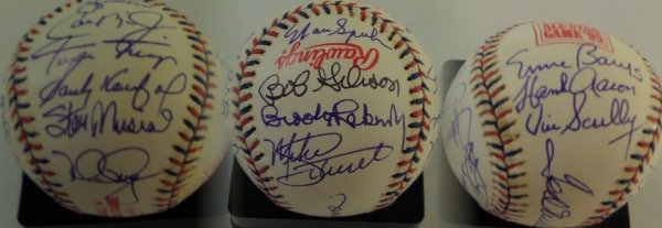 This Official 1999 All Star Game baseball from Rawlings is cubed in EX/MT condition, and is laced in red and blue.  It comes hand-signed all over in blue or black ink by 19 members of the famed All Century Team, chosen in 1999.  Included are Hank Aaron, Willie Mays, Clemens, McGwire, Ripken, Banks, Berra, Griffey, Spahn, Schmidt, Bench, Williams (ss), Koufax, Scully, Musial, Rose, B. Robinson, Gibson and Ryan.  A stunning baseball with so many all time greats, and with 8 now deceased, retail is low thousands!!!