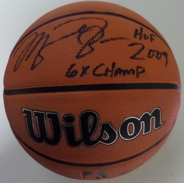 This Authentic Series basketball from Wilson is in NM condition, and comes hand-signed in bold black sharpie by NBA All Time Great, Michael Jordan.  The signature grades a clean, legible 8 at least, including HOF 2009 and 6X Champ inscriptions, and the ball is valued into the very high hundreds!