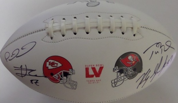 This amazing Super Bowl collector's item is a full size, Super Bowl LV Chiefs/Buccaneers logo white panel football, hand-signed by TWO different all time great QB/TE combos!  Included are Tom Brady, Rob Gronkowski, Patrick Mahomes and Travis Kelce, all in black sharpie, and with all 4 absolutely guaranteed to be in the Hall of Fame, retail is low thousands!