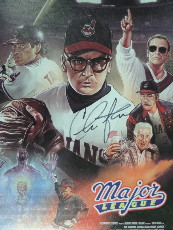 This full color "Major League" movie poster print litho is done on real canvas, and stretched around a 15x19 wooden inner frame.  It is 100% ready for display, features color images of stars and scenes from the hit 1989 baseball movie, and is hand-signed in black sharpie by its star, "Wild Thing" actor, Charlie Sheen.  It is a MUST for any baseball or film collection, and retail is mid hundreds, at least!