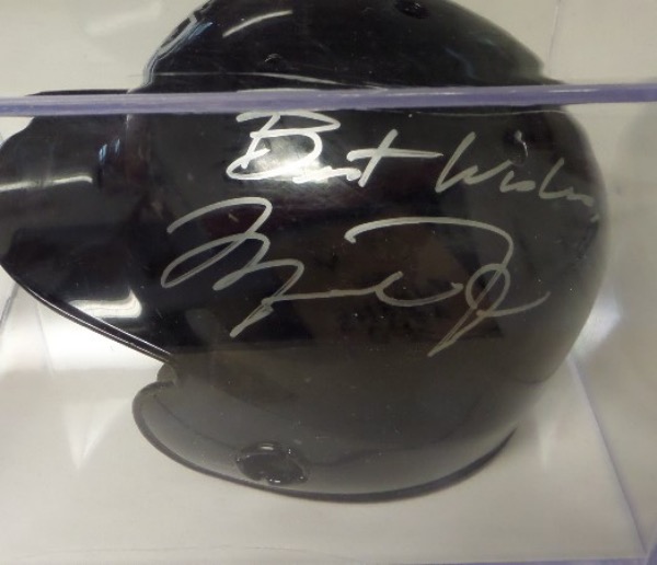 This rarely seen 1994 era baseball mini helm,et comes side panel signed by its most famous ever player, Michael Jordan, and grades a bold 10 in stunning silver paint pen. "Best Wishes" is written as a bonus, and value with the free Cubed display case is about $1200.00. We have never seen one of these before..please bid accordingly!