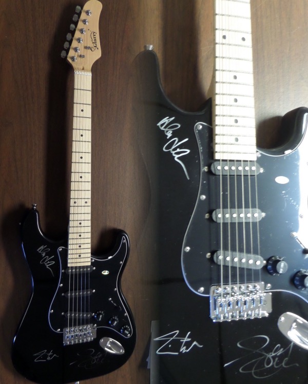 This mint and boxed GORGEOUS black electric beauty comes signed by the big 3 from this HOF Canadian band perfectly in silver sharpies. Included are Geddy Lee, Neil Peart, & Alex Lifeson!!  Guaranteed authentic and retails into the low thousands. As nice as it gets and ideal for the Rock N Roll collector.  Rare with the now deceased Peart signature!