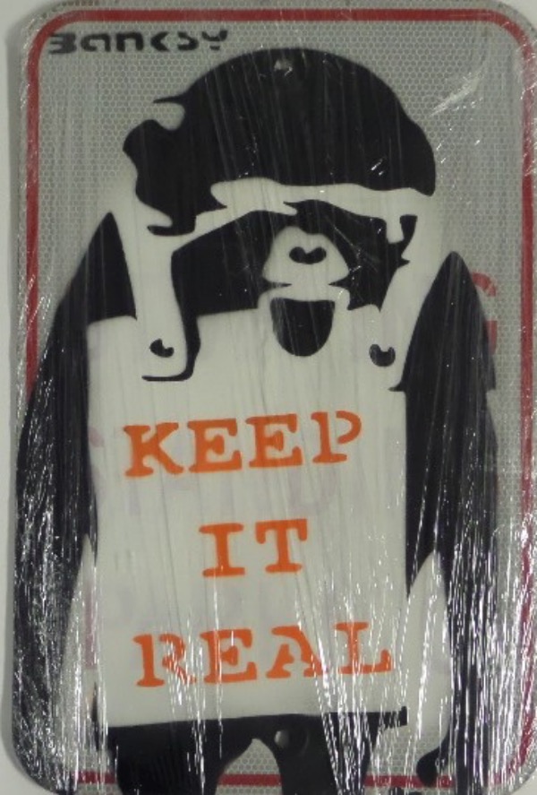 This approx. 12"x18" metal street sign comes painted by this street artist in black and orange! He depicts a monkey on it with "Keep it Real" on his body!  perfect for display and he has signed it up on the top left in black.  Amazing offering and valued well into the thousands. 