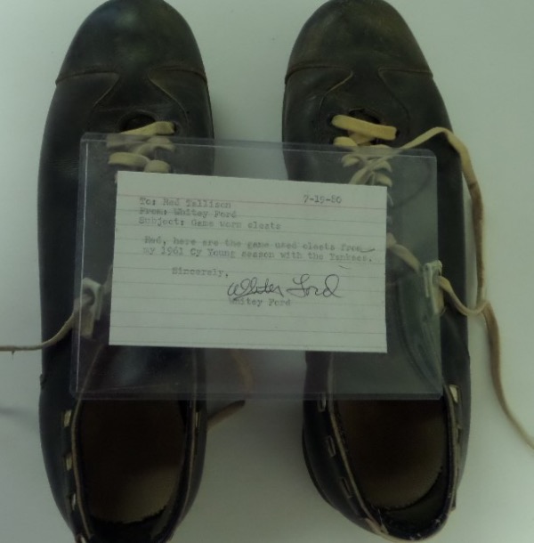 These well worn black leather baseball spikes were owned, worn and sold by the HOF pitcher, and were used during the 1961 Championship season in the Bronx. There is a hand signed note from Whitey included, that is certified real for life by PSA/DNA, and value of this historic NYY lot is thousands! 