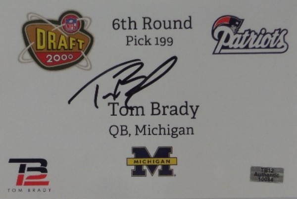 This $2000.00 NFL/NCAA item has both the Michigan and Patriots team logos on it, measures near 5x7 in size, and announces Toms round 7 draft in 2000. It is a cool item, comes black marker signed by Brady,, and even has his own "TB Authentic" hologram affixed for iron clad certainty. Wow!