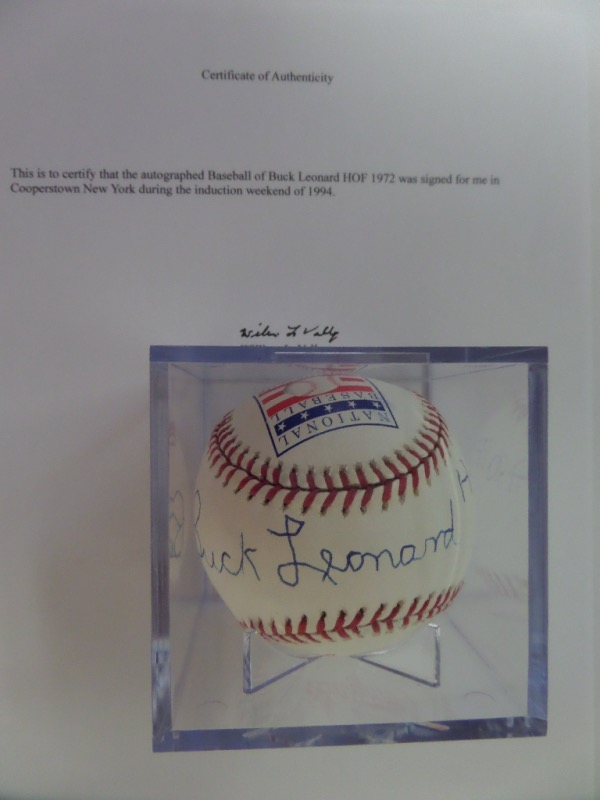 This National Baseball Hall of Fame logo baseball from Rawlings is cubed in NM condition, and comes hand-signed all the way across the sweet spot by HOF Negro League 1st baseman, Buck Leonard.  The signature grades a later in life, legible 8.5, complete with a HOF 1972 inscription, and the ball comes with a letter of provenance from the original collector.  Valued into the mid hundreds from a true diamond legend!