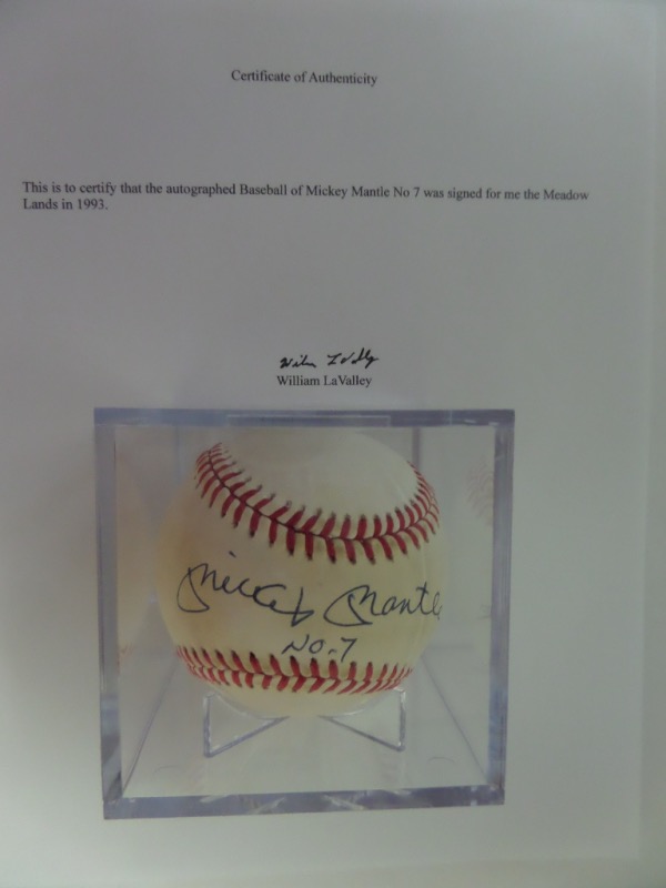 This Official American League Baseball from Rawlings is cubed in VG+ condition, and comes hand-signed across the sweet spot in blue ink by HOF Yankees great, Mickey Mantle.  The signature grades a clean, legible 9, with No. 7 added in his hand, and the ball includes a letter of provenance from the original collector for authenticity.  Valued into the mid/high hundreds!