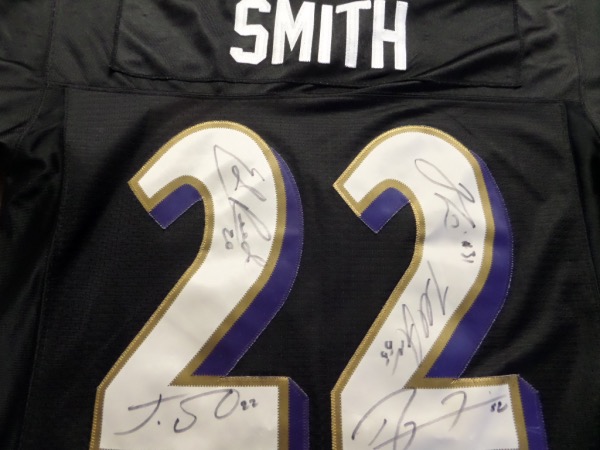 This black size M Smith #22 Baltimore Ravens jersey from Reebok On Field is in EX/MT condition, and comes with everything sewn.  It is back number-signed in black sharpie by five stars of the team that took home Super Bowl XXXV, Super Bowl XLVII, or both, including HOF'ers Ray Lewis and Ed Reed, as well as stars Terrell Suggs, Jamal Lewis and Jimmy Smith.  A MUST HAVE for Ravens fans, and retail is low thousands!