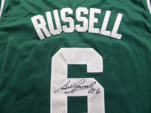 This MUST HAVE NBA item is a size 54 green custom Boston Celtics #6 Russell jersey from Nike, still tagged as NEW, and trimmed in white, with everything sewn.  It is back number-signed in black sharpie by the greatest center EVER, grading a legible 8, and with Russell no longer with us, retail is low thousands on this collector's gem!