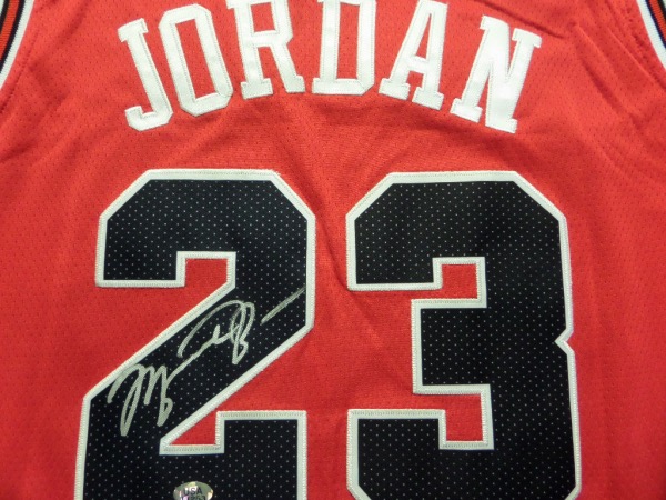 This red size 50 Jordan Bulls jersey from Nike is still NEW with original tagging attached, and comes trimmed in black and white, with everything hand-sewn.  It is back number-signed in bright silver by the 5 time MVP and HOF great himself, and is really a looker.  Ready for your framing touch, and retail is low thousands on this RARE AIR item!