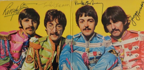 This vintage 1967 "Sgt. Pepper's Lonely Hearts Club Band" LP album is in EX overall shape, and opens to an image of The Fab Four against a yellow background.  It comes ink signed by John Lennon, sharpie signed by Paul McCartney, Ringo Starr and George Harrison, and looks absolutely GORGEOUS!!!  Retail is well into the thousands!