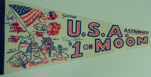 This 30" long "U.S.A. #1 on Moon" white pennant is still in EX+/NM condition overall, with an Apollo 11 logo, artist's images of the astronauts, and events listed by time.  It is hand-signed in blue sharpie by all three, including Neil Armstong, Buzz Aldrin and Michael Collins, and retail on this gem is easily into the low thousands!