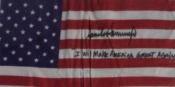 This unique political collector's item is a mini American Flag, in overall EX condition, and measuring about 8x12 in size.  It is hand-signed by #45 himself, former United States President, Donald Trump, and grades an overall 9, complete with an "I Will Make America Great Again" inscription.  A super cool item, valued at PRICELESS!