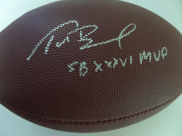 This mint Wilson NFL football comes signed wonderfully in silver by the best ever with "SB XXXVI MVP" included! Great ball to display and retails well into the thousands. WOW!