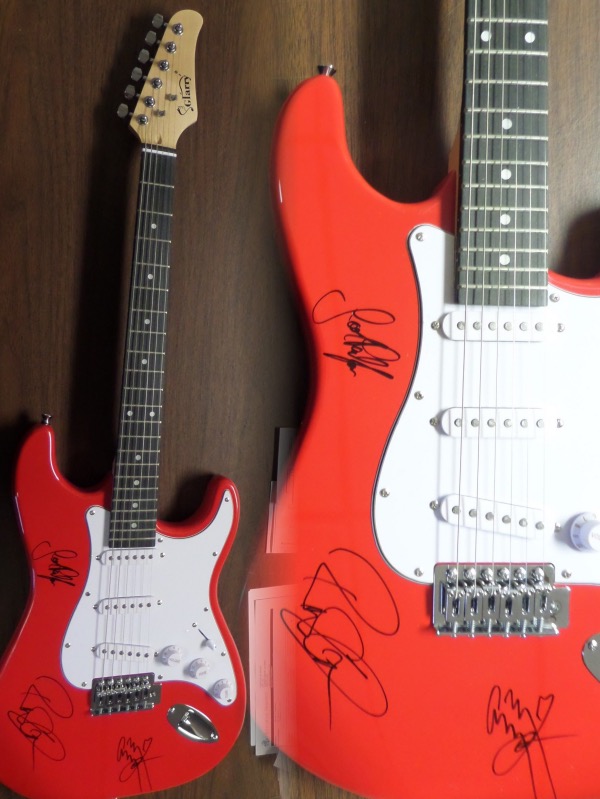 This GORGEOUS mint electric guitar comes signed on the gem wonderfully in black sharpies by ROBERT PLANT, JIMMY PAGE, & JOHN PAUL JONES!! Signatures are guaranteed authentic and the rare guitar is perfect for framing and showing off. Retails into the thousands easily from 1 of rock's all time best.